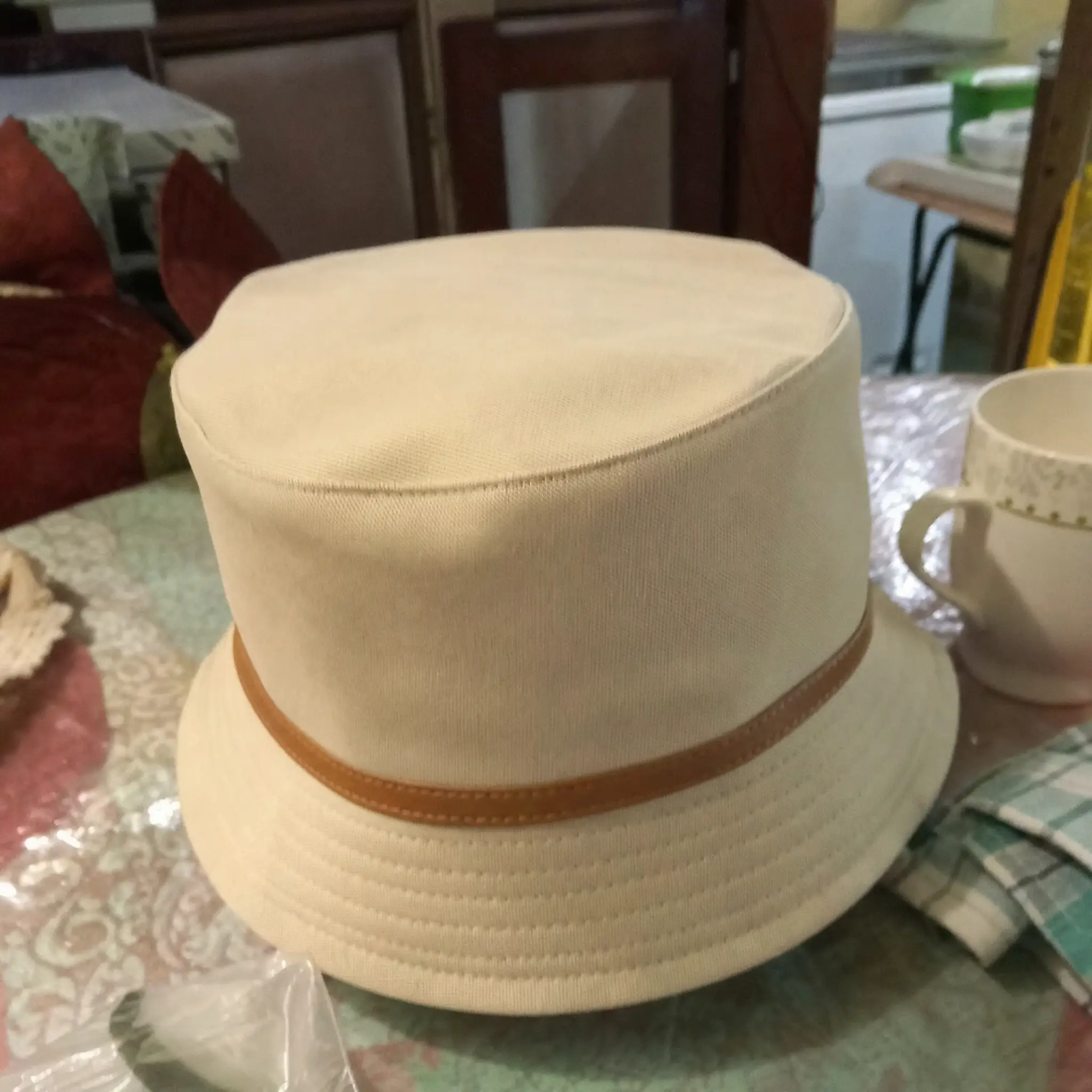 A bucket hat photographed at home on a kitchen table